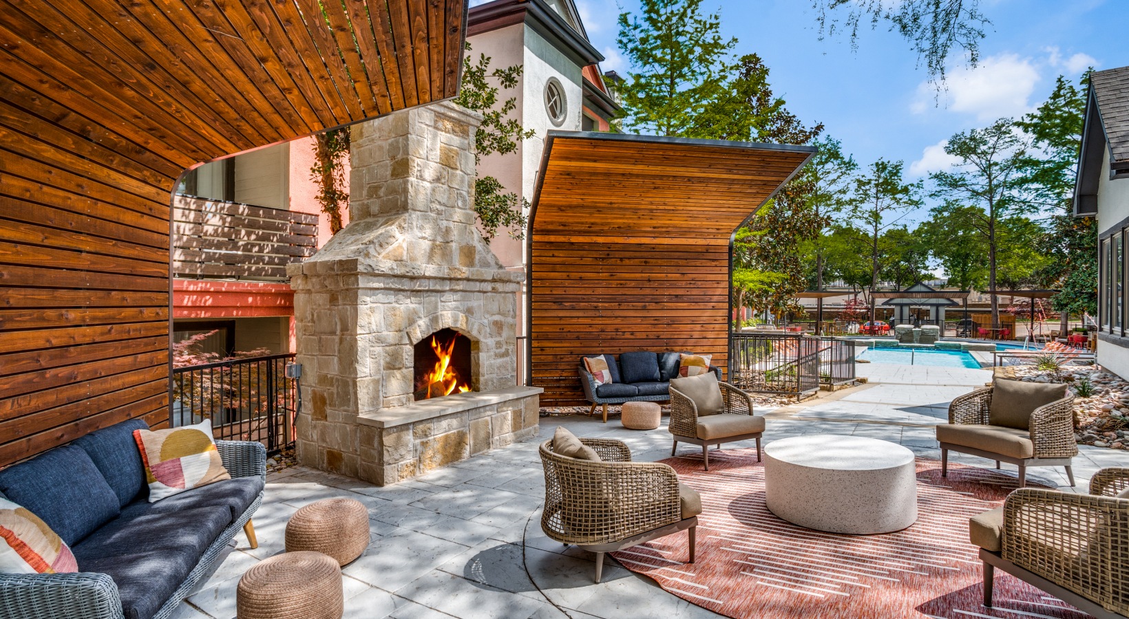 outdoor living area with fireplace and patio furniture at The  Lana