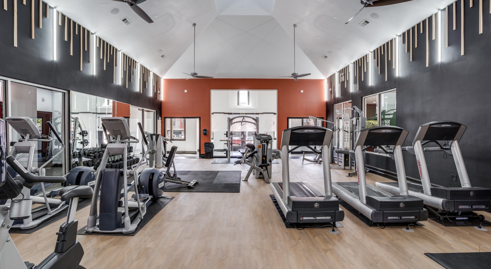 a gym with treadmills and exercise equipment at The  Lana